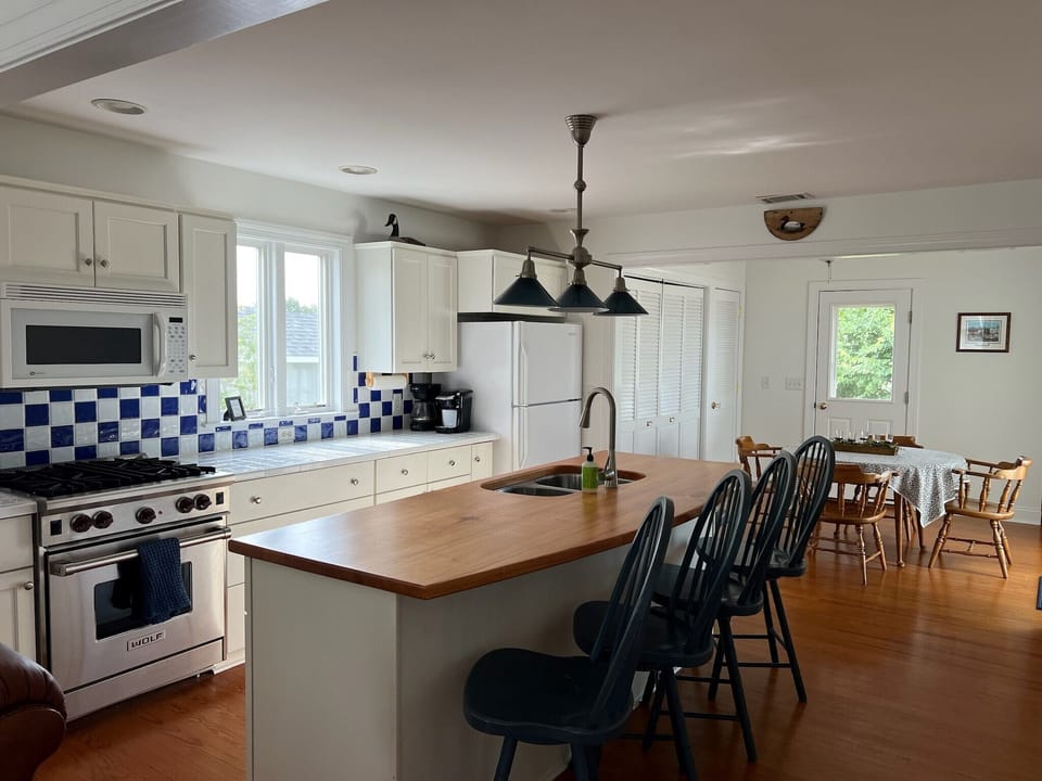 Full size washer and dryer located behind the bifold doors.