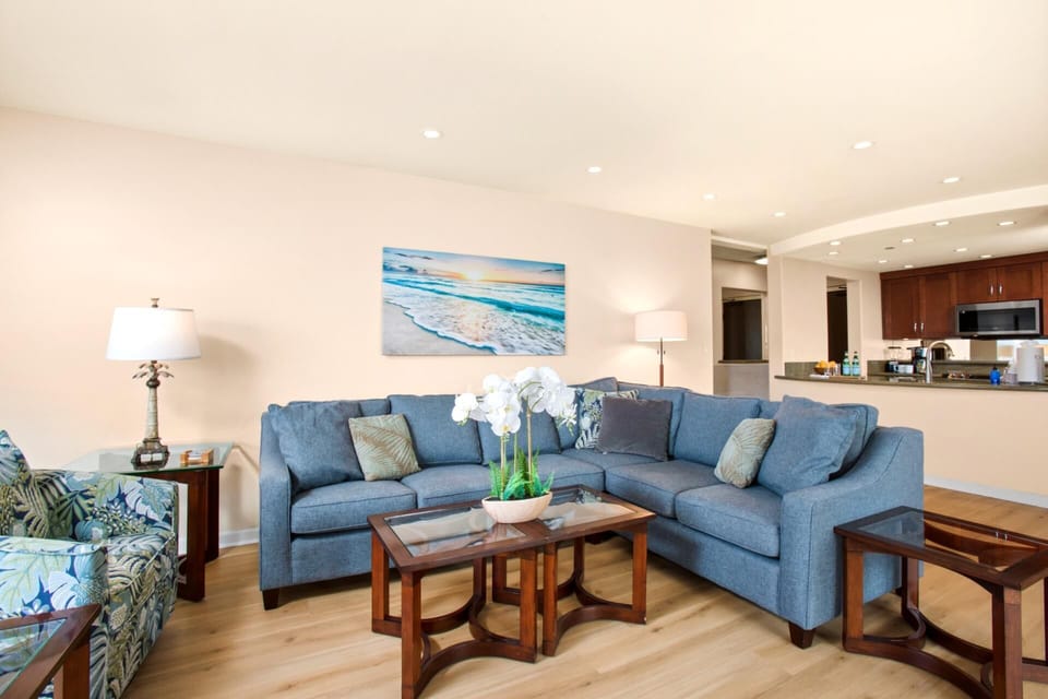 Gather around the elegant dining area, featuring a stylish glass table and comfortable chairs with tropical flair. This space offers the ideal setting for memorable meals with family and friends, enhanced by beautiful garden views.