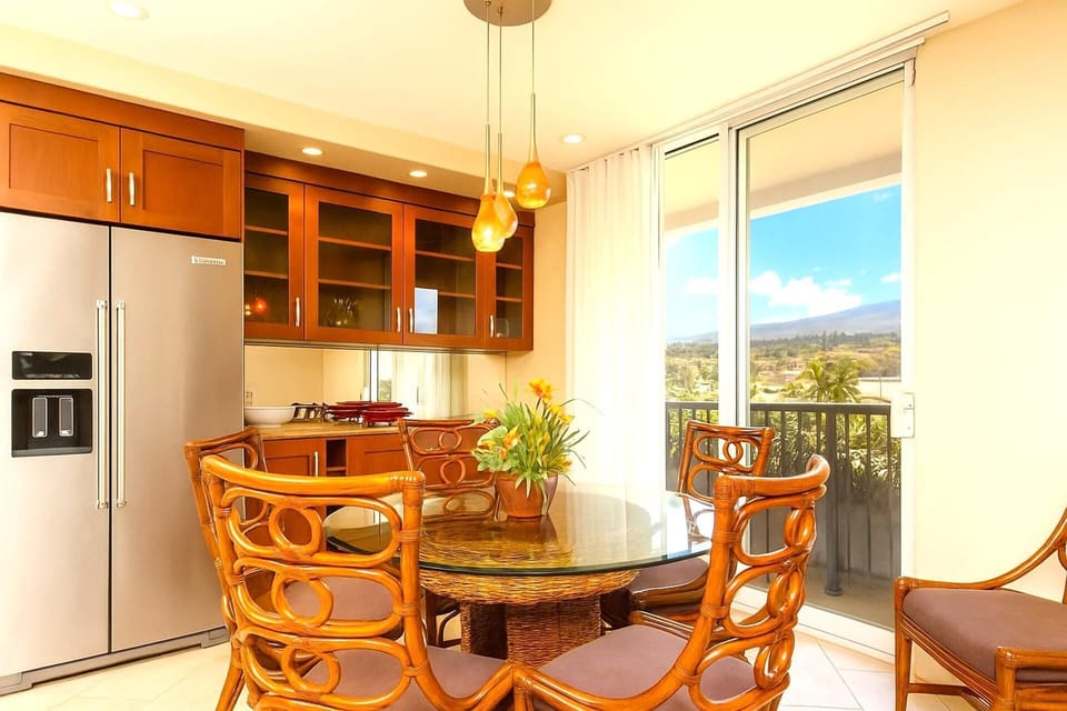 Enjoy cooking in a modern kitchen equipped with high-end appliances and ample storage. With scenic views right outside the window, meal preparation becomes a delightful part of your island lifestyle.
