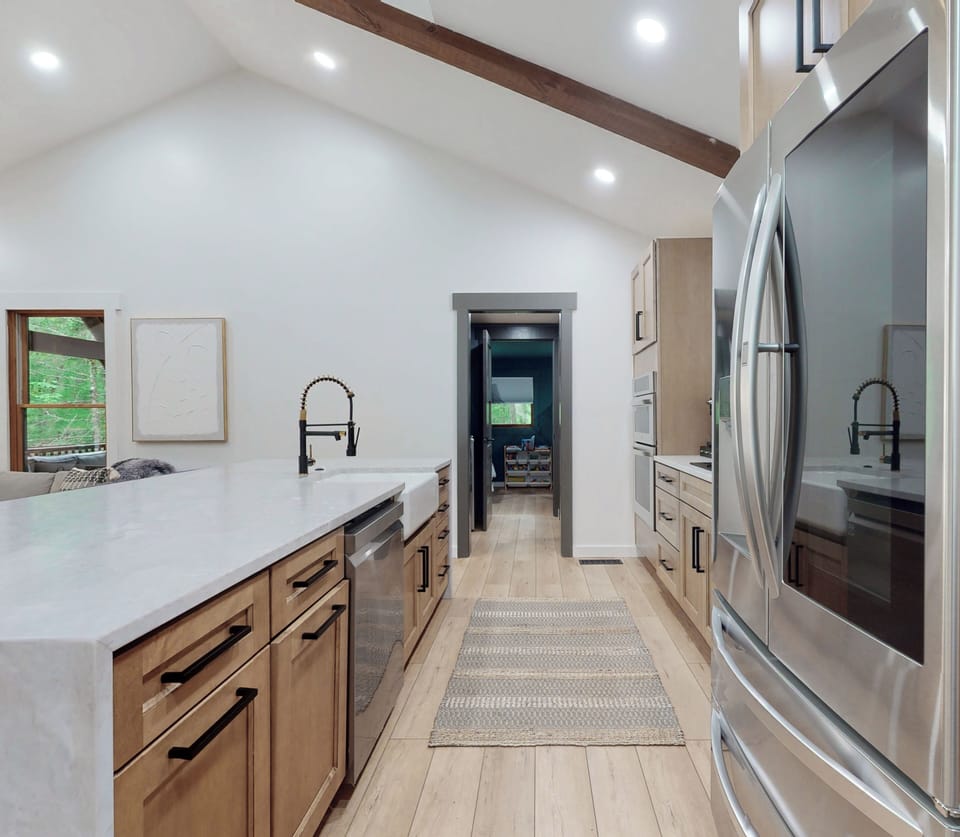 Opposite view looking into mud/pantry/laundry and into bunk room and bathroom