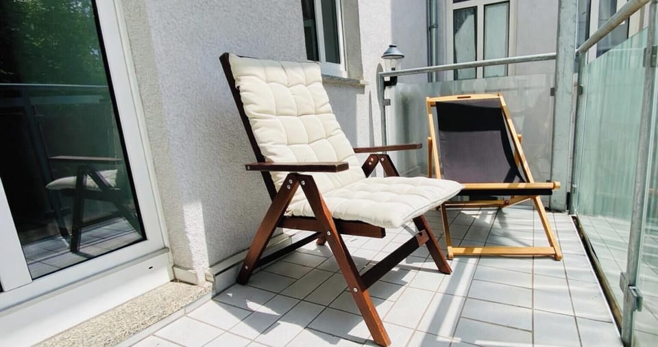 Sunny balcony with cozy seating