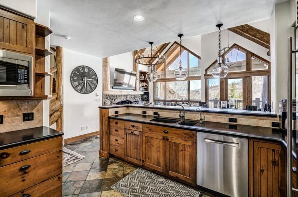 Cook up a feast in our fully-equipped kitchen, featuring rustic touches, modern appliances, and ample counter space. Perfect for culinary enthusiasts.