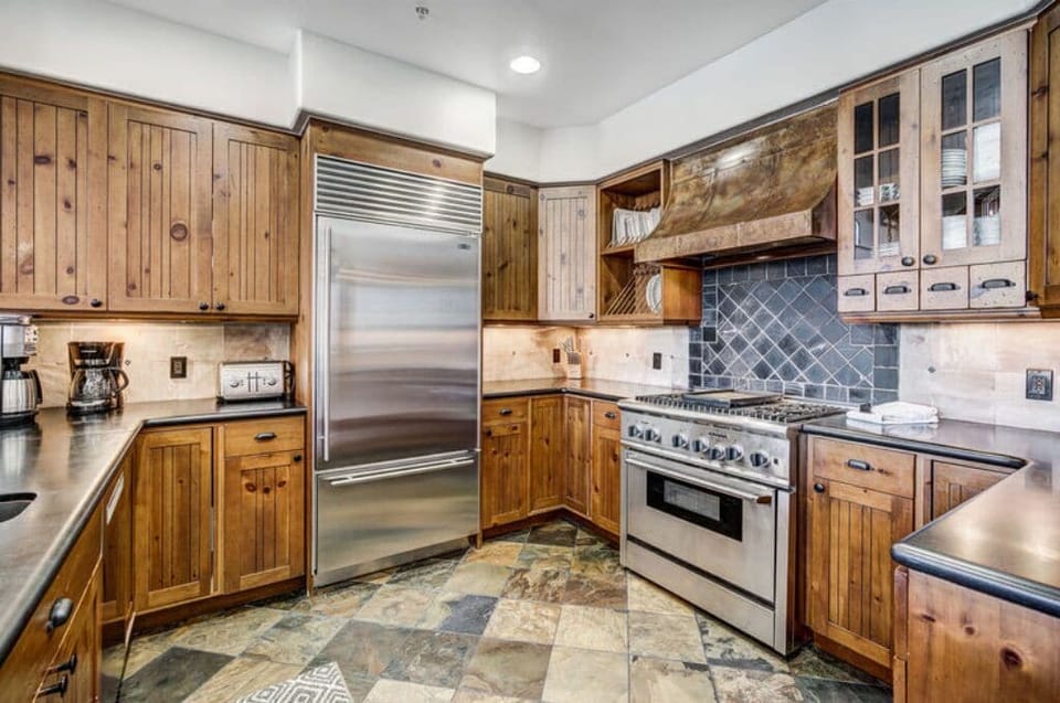 Cook with ease in our fully-equipped kitchen, featuring modern amenities, stainless steel appliances, and ample counter space. Ideal for preparing gourmet meals.