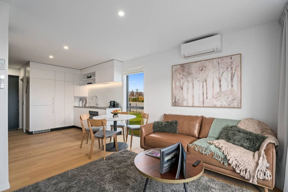 Open plan living area includes lounge, dining area and kitchen