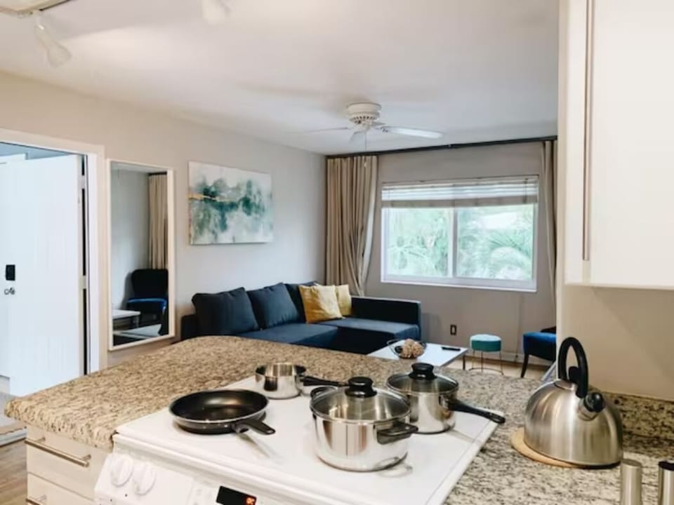 Savor the essence of culinary delight in our kitchen, seamlessly flowing into the dining room. A charming table for four awaits, where every meal becomes a shared moment in a space designed for warmth and connection