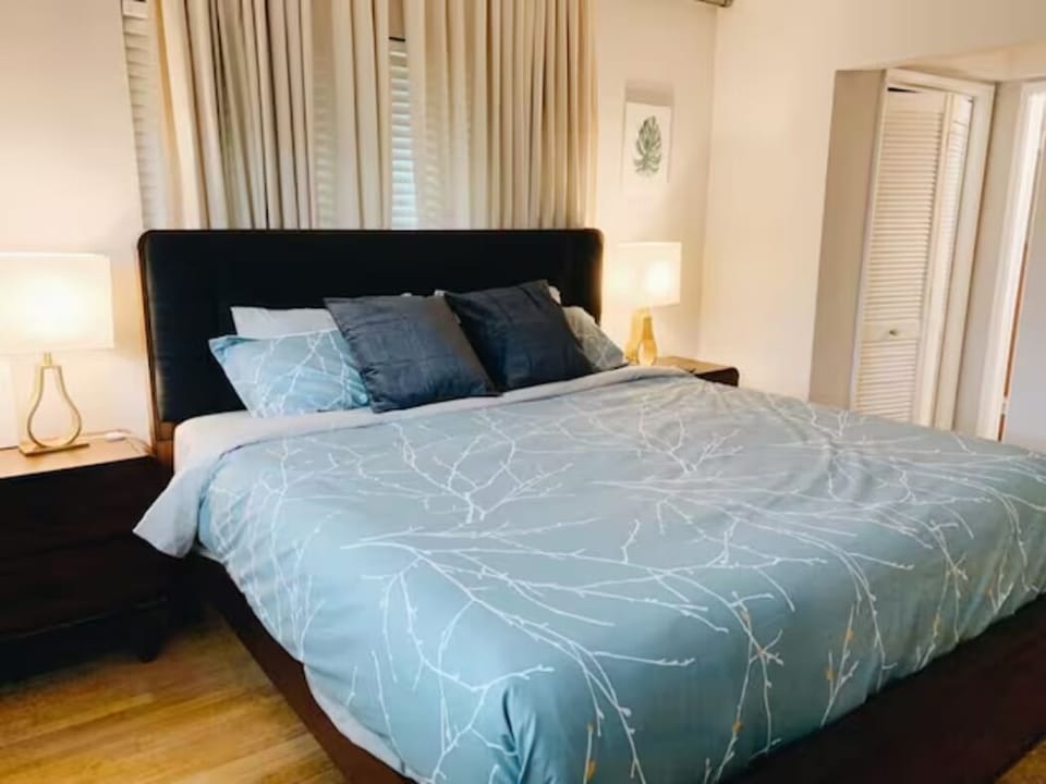 Embrace luxury in our king-size haven. Flanked by elegant side tables, adorned with night lamps casting a warm glow, and framed by captivating wall paintings — a harmonious blend of comfort and artistry for a truly regal retreat.