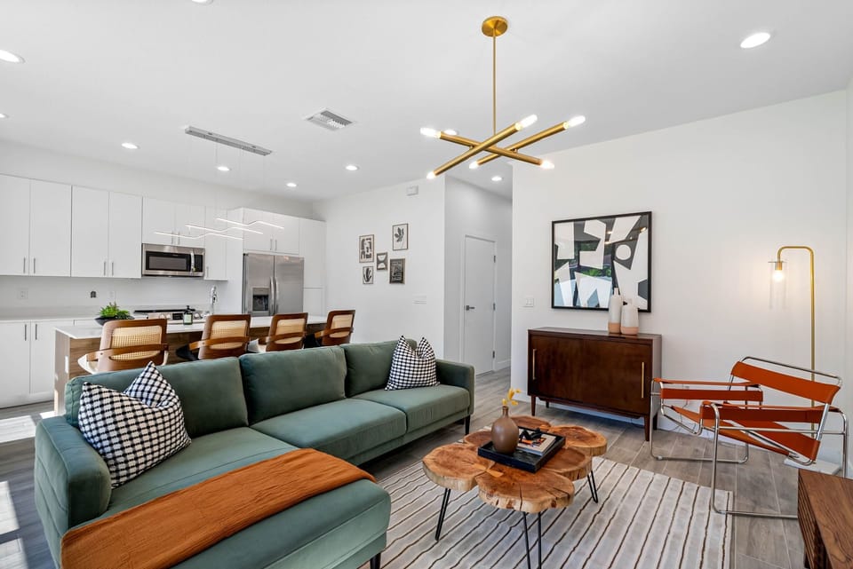 Experience the elegance of our modern living room with an open floor plan, designed for comfort and style!