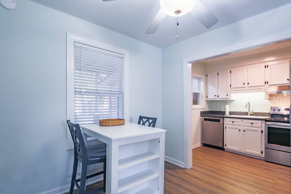 There is a door in the kitchen area that leads to the laundry room and covered back deck.