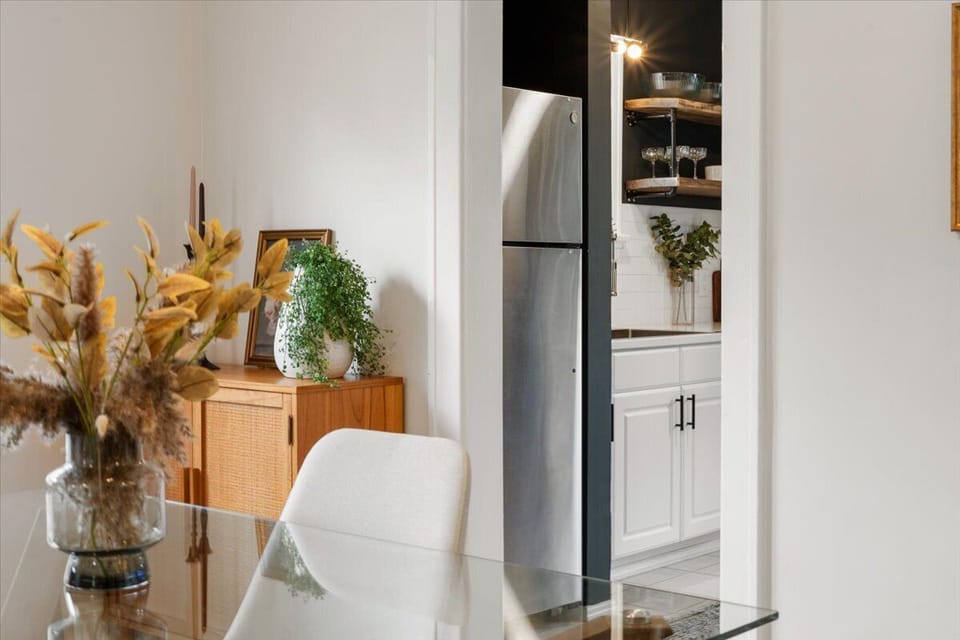 Dining table with seating for two and plenty of storage in the two sideboards.