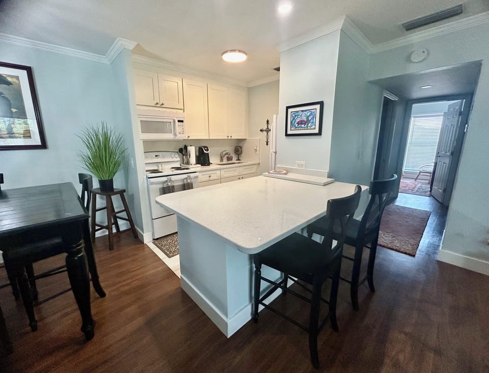 Open floor plan with seating at kitchen countertop