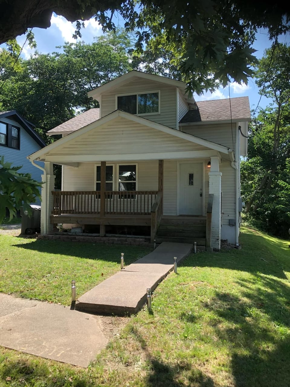 Front of house with porch.