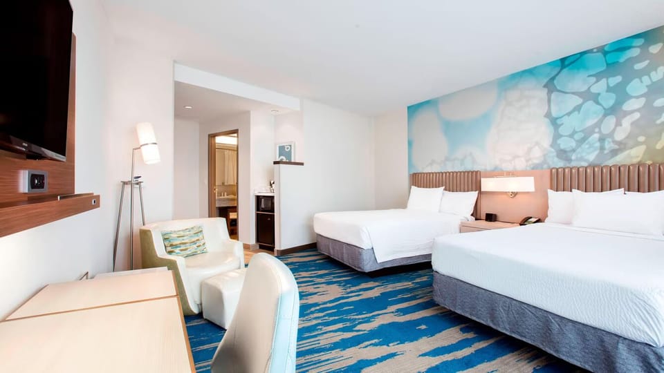 Unit with 2 Queen beds. Exact unit will be assigned upon arrival. Views, colors, and decor may vary.