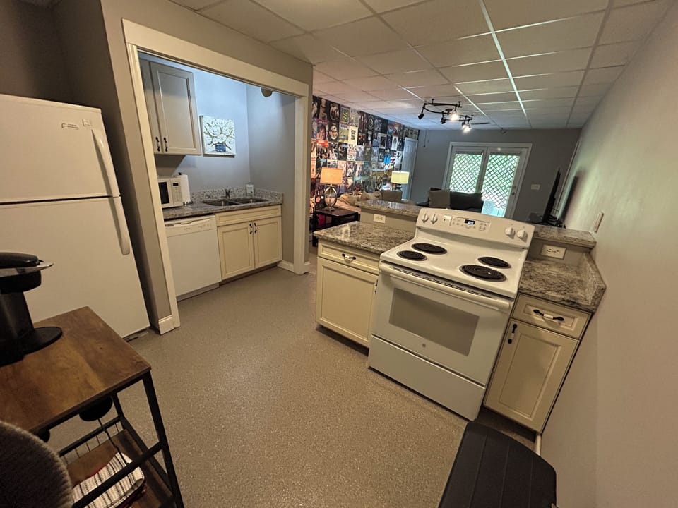 Kitchen with range/oven, refrigerator, and dishwasher