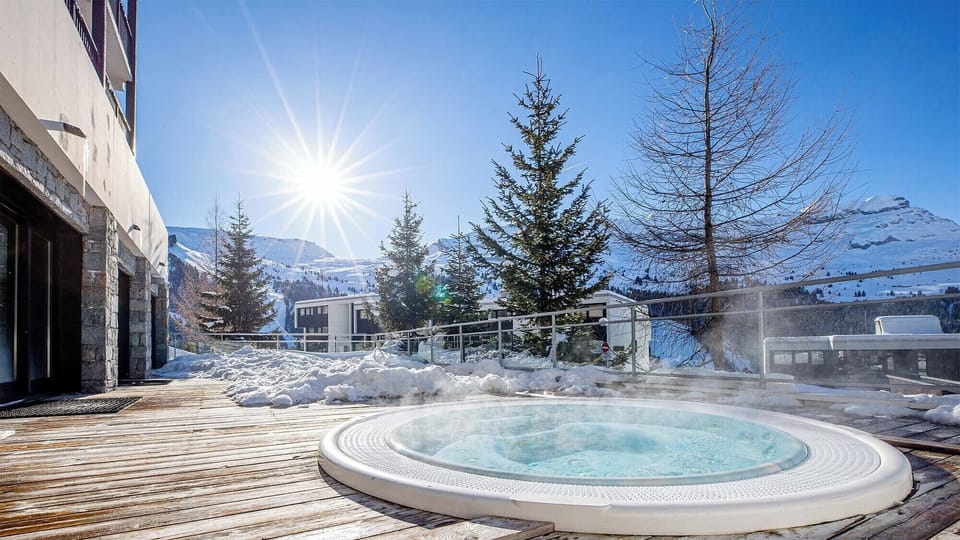 Take a dip in the shared outdoor hot tub!