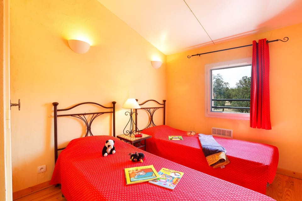 The second bedroom contains 2 Single beds.