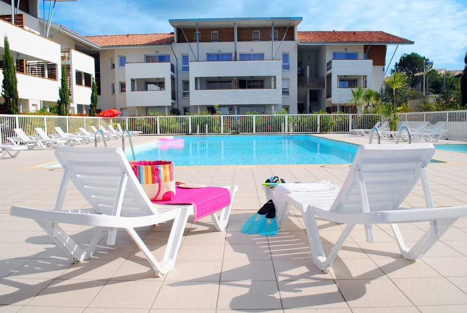 Lounge by the pool in the sunshine.