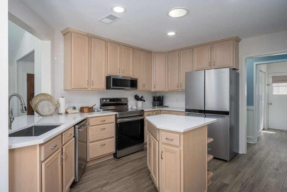 Kitchen opens into hallway to the bedrooms