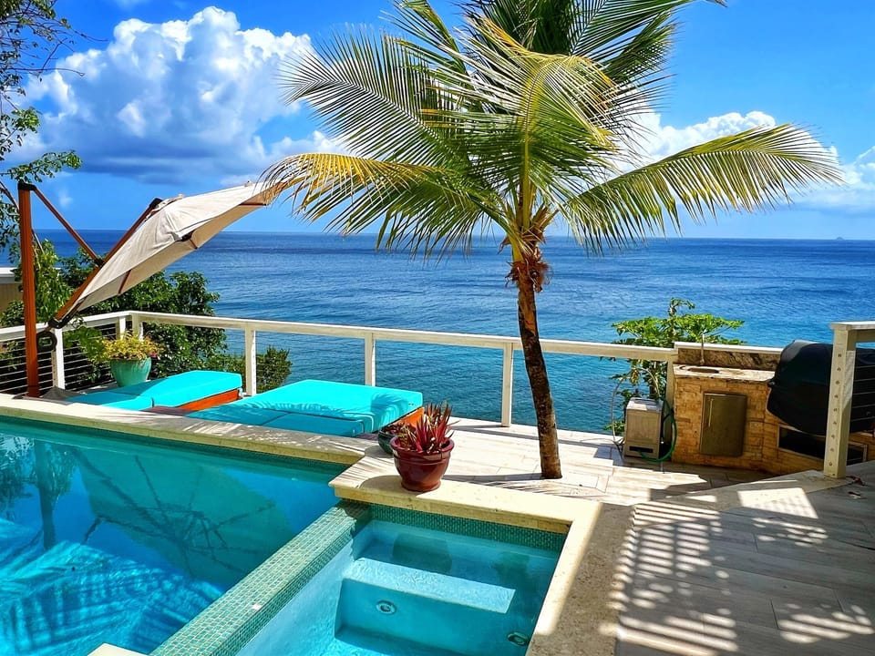 You have it all. The photo ops, the lounging, the views, the sounds of the ocean, the warm Caribbean breeze, and a relaxing pool. Please note the area next to the pool is NOT a hot tub. The only water amenity offered is the pool. 