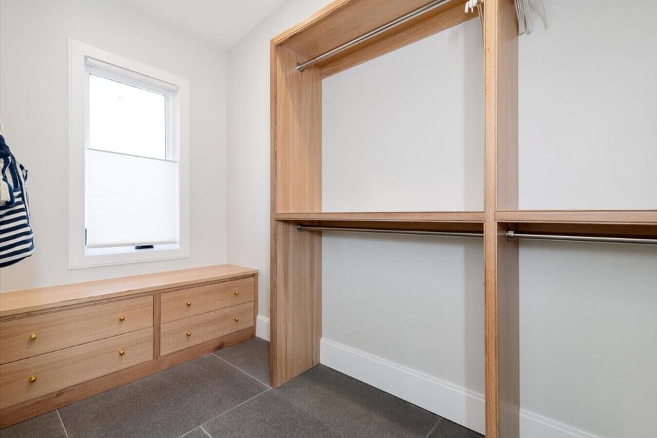 Primary custom oak walk in closet