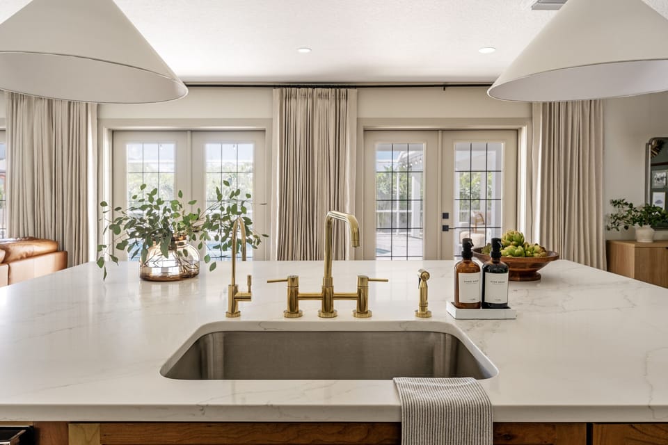 Kitchen glows with natural light, radiating warmth and vitality.