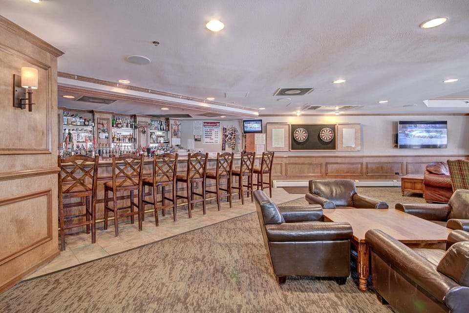 The lobby features a fully stocked bar and comfortable seating.