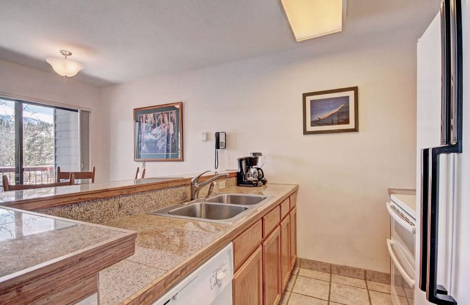 Create culinary delights in the gourmet kitchen with expansive countertops, modern appliances, and plenty of workspace.