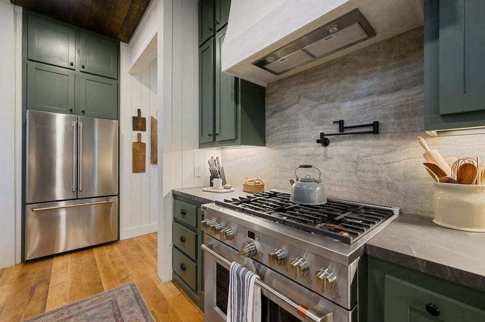 Gas stove top with pot filler