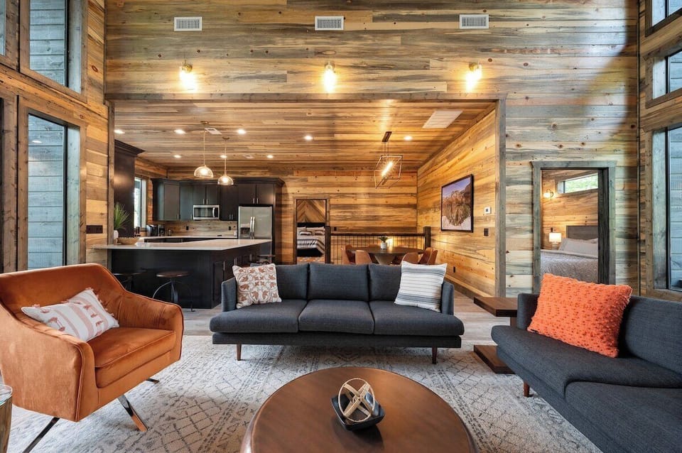 Living room opens to kitchen and dining areas