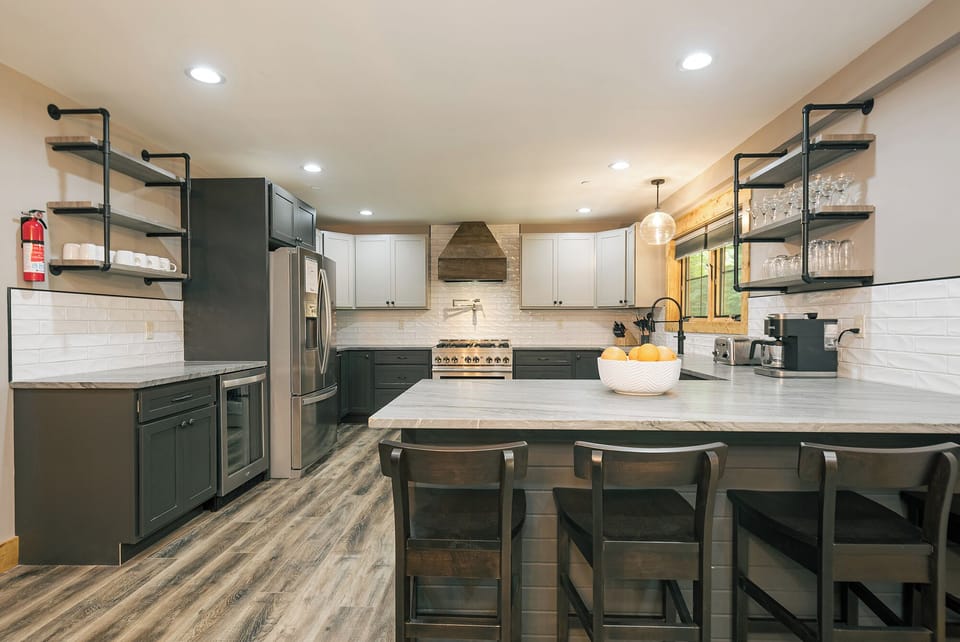 Fully-equipped, the kitchen has seating for four at the breakfast bar.