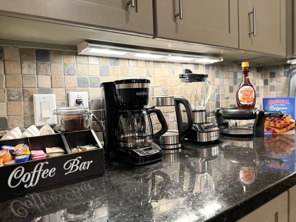Belgian waffle and Colombian coffee with various type of creamer are provided.