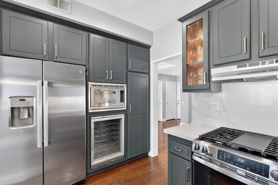 Kitchen is fully equipped and features stainless steel appliances.