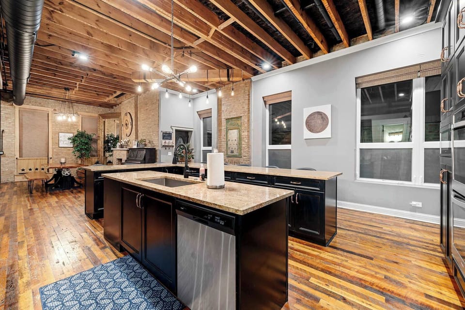 Kitchen angle showing ample prep space and an easy flow into dining and living areas.
