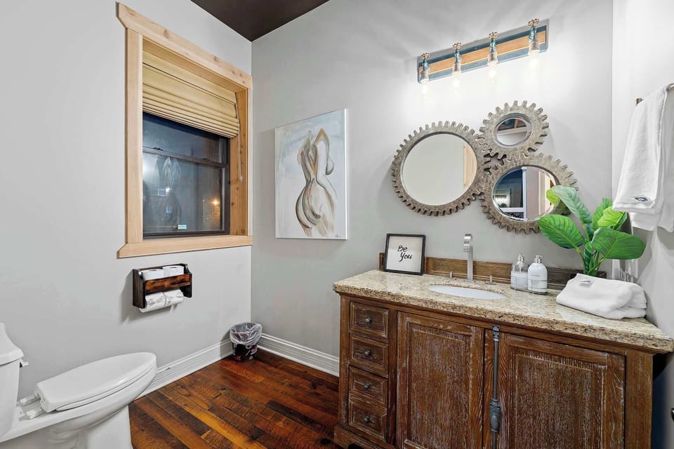 Clean bathroom vanity w/ modern fixtures, mirror lighting, and a neat, refreshed look.

