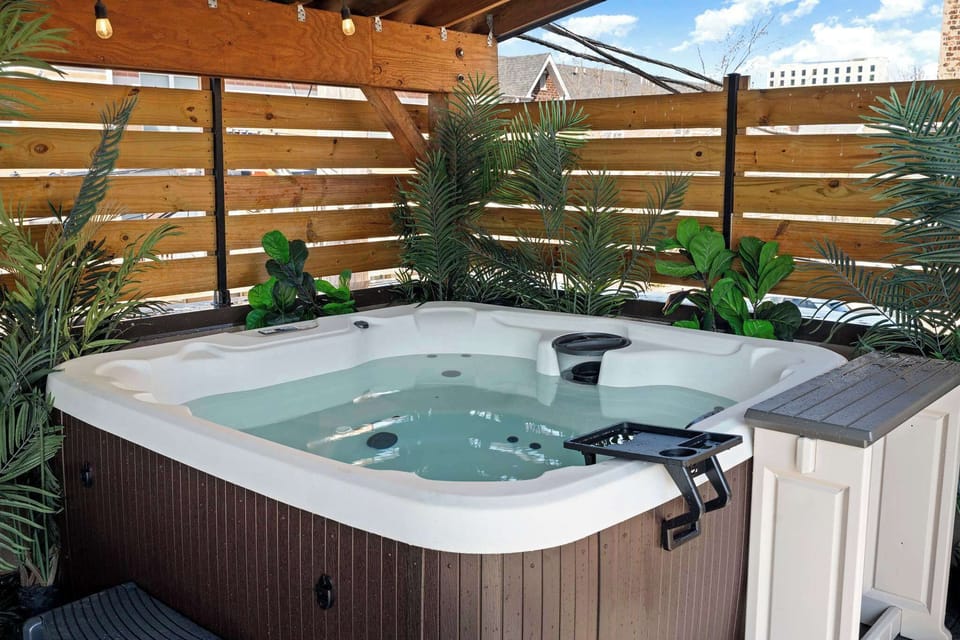 Covered hot tub area framed by wood accents, ideal for unwinding any time of day.