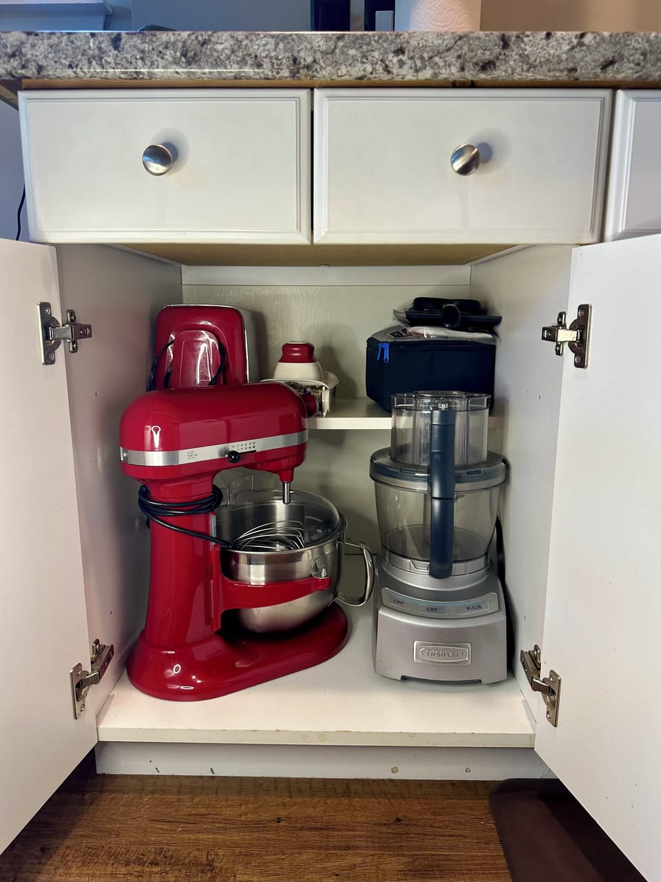 The kitchen is compact but fully equipped, stocked with high-quality pots, pans, and everything you need for cooking and baking.