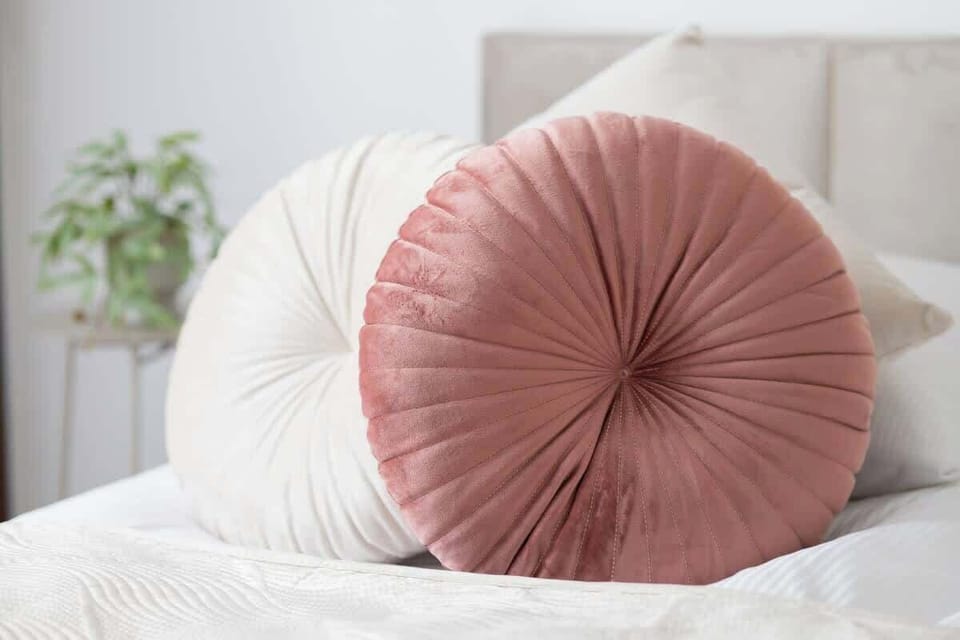 Decorative elements/bed with set of bedding and cushions.