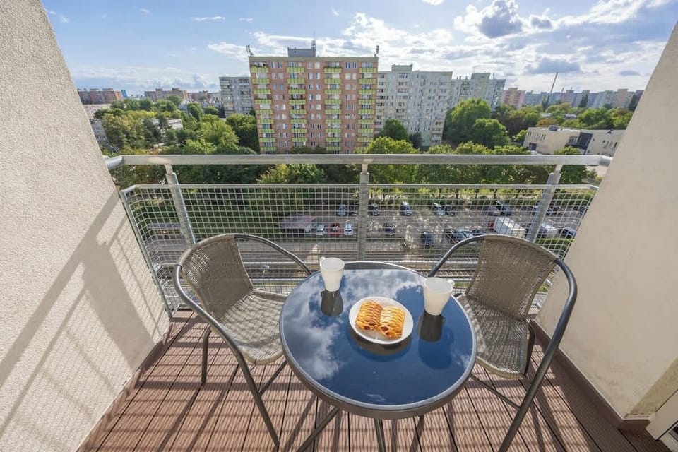 Balcony equipped with garden furniture overlooking the surroundings.
