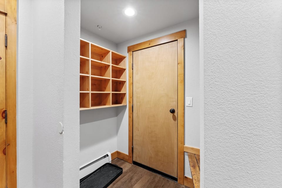 Your own private mudroom features custom cubbies for gear organization, perfect for storing ski equipment and outdoor essentials during your mountain getaway.
