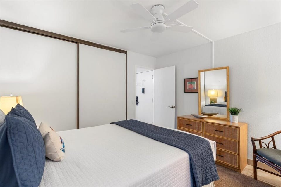Bedroom area includes a wall AC unit