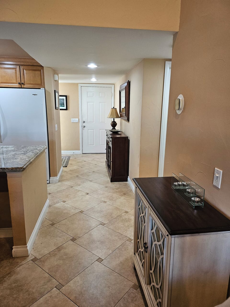 Nice, bright entryway with wine rack. Washer and Dryer in garage.