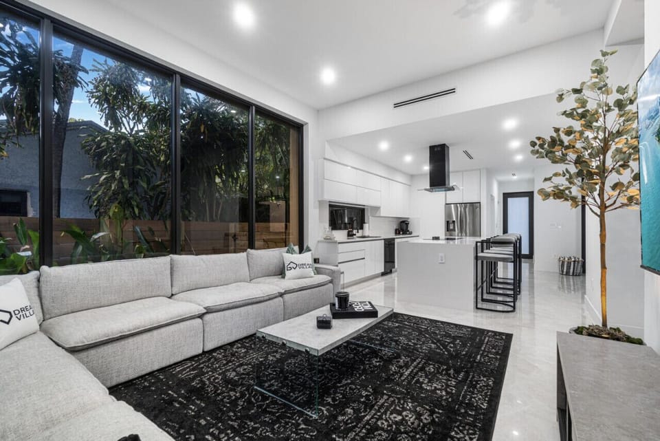 Interact with your group in the living room while cooking meals in the kitchen.