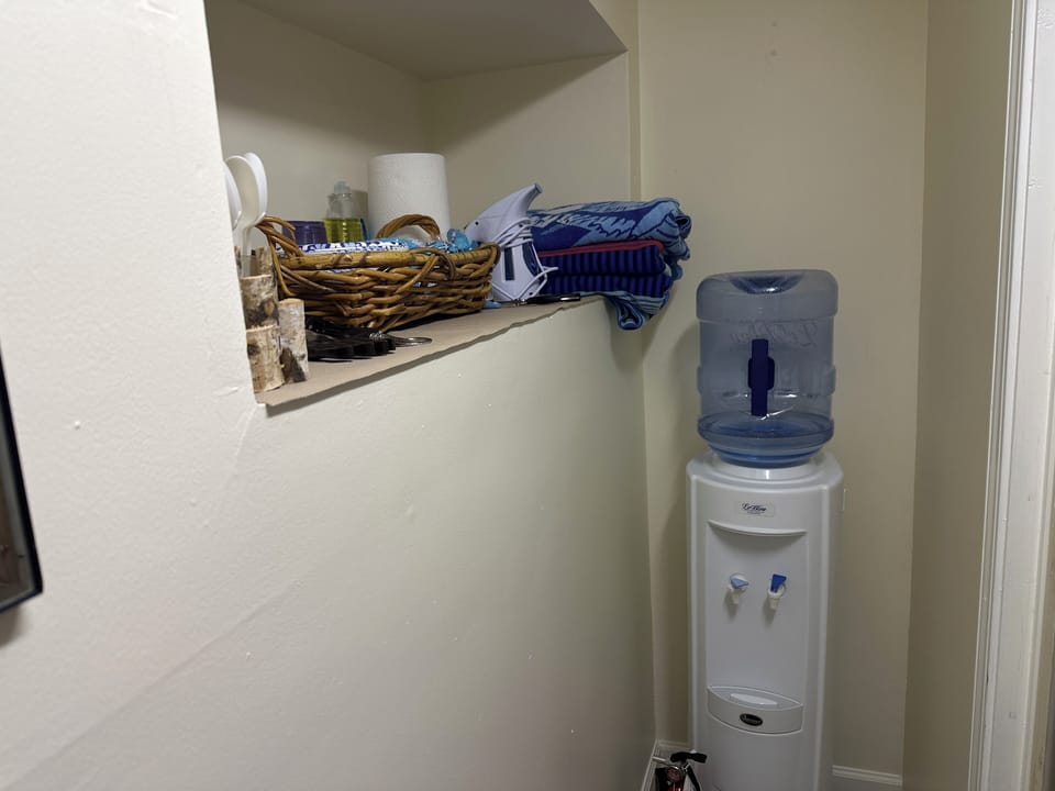 Fresh water cooler and kitchenette supplies.