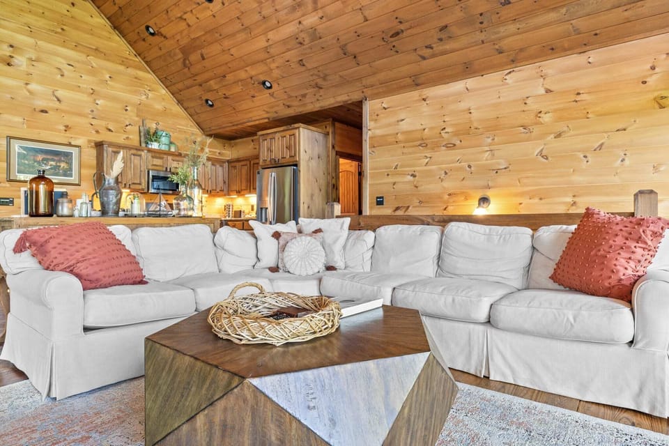 Plush seating surrounding a stylish wooden center table