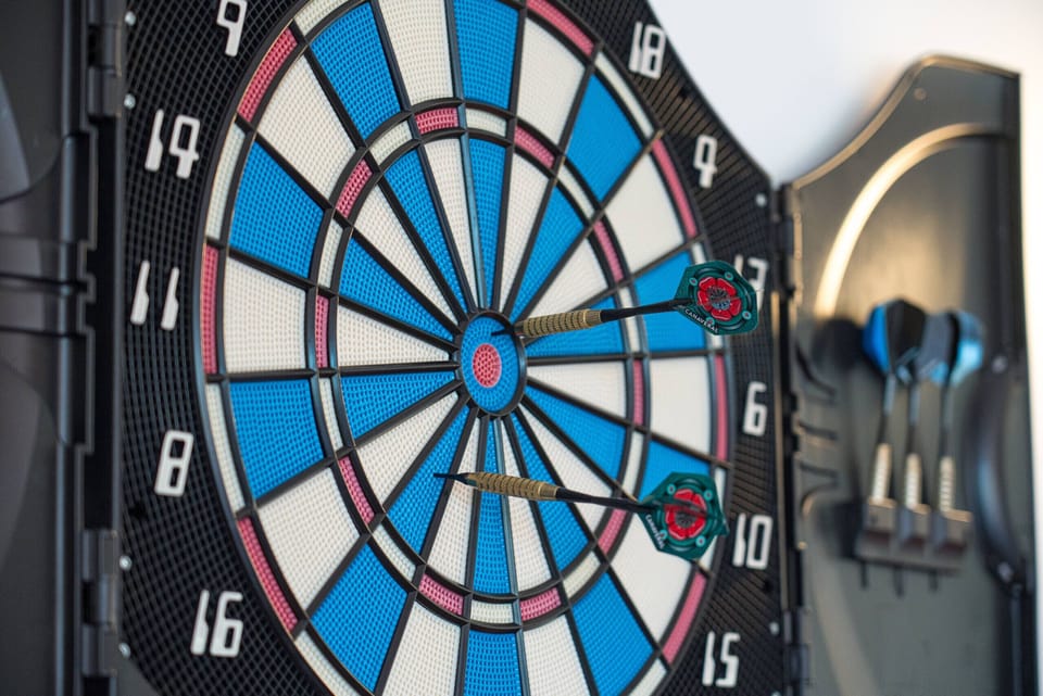 Electronic dartboard with two darts embedded — Villa Atlantic Blue, holiday villa in Mafra