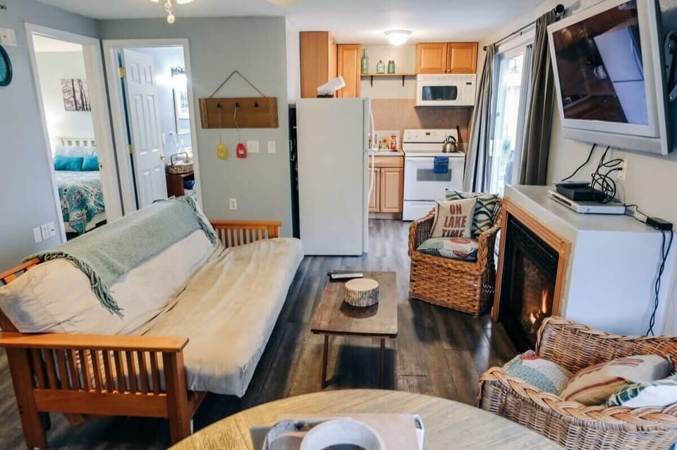 a view into the kitchen and bedroom