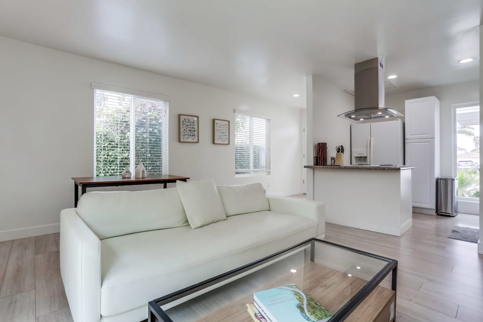Reverse view of the living room with coffee table and sleek sofa