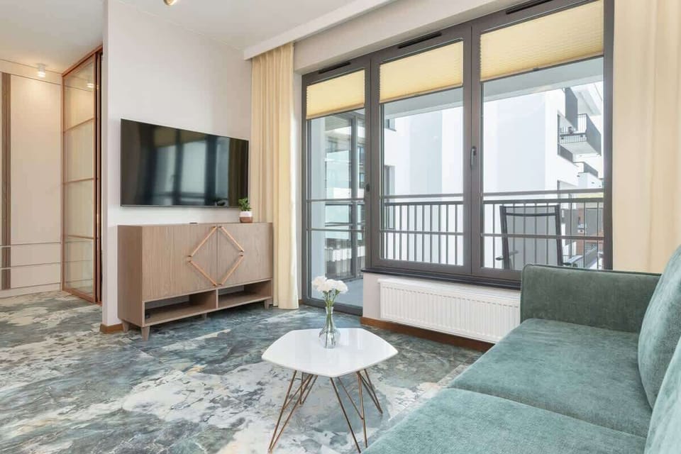 Lounge area is furnished with a cosy sofa bed, which invites you to rest and relax. An additional form of entertainment is provided by the Smart TV.