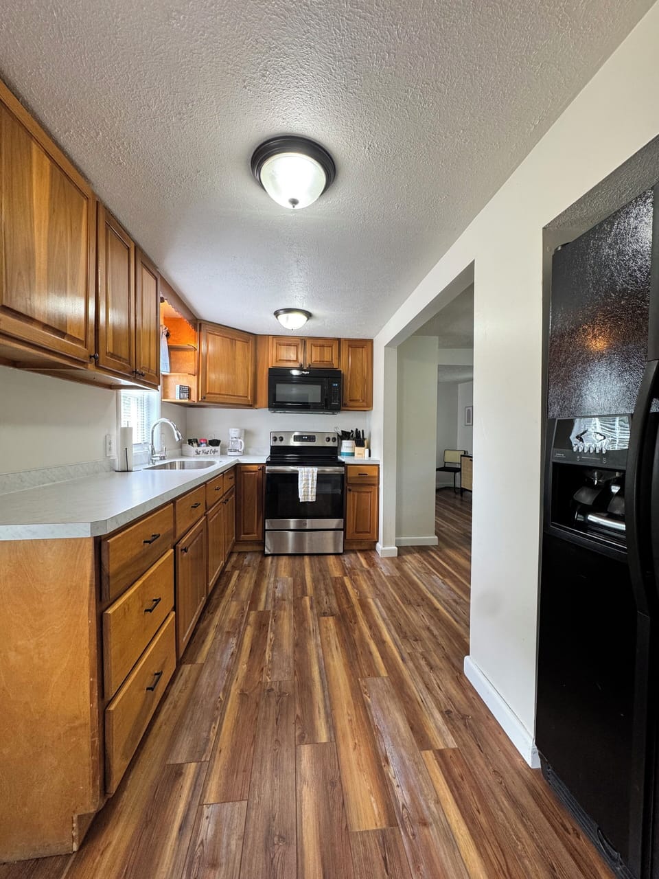Fully stocked kitchen with coffee bar. 