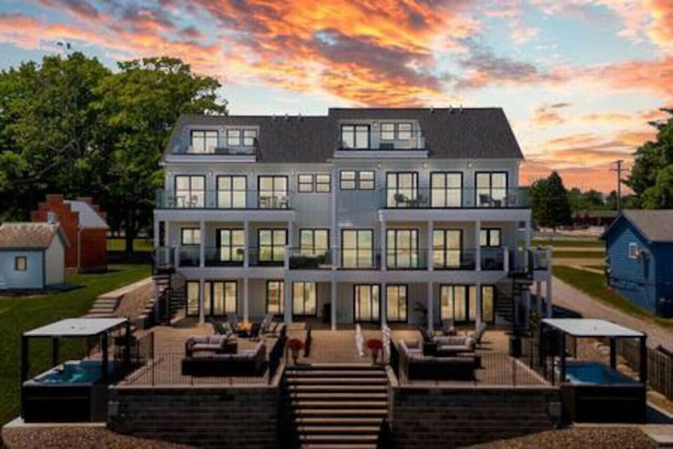 The back of the home features a spacious outdoor area designed to maximize enjoyment of the stunning