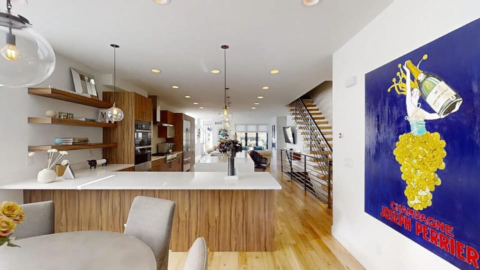 Main floor open concept with kitchen, dining area, and living room.